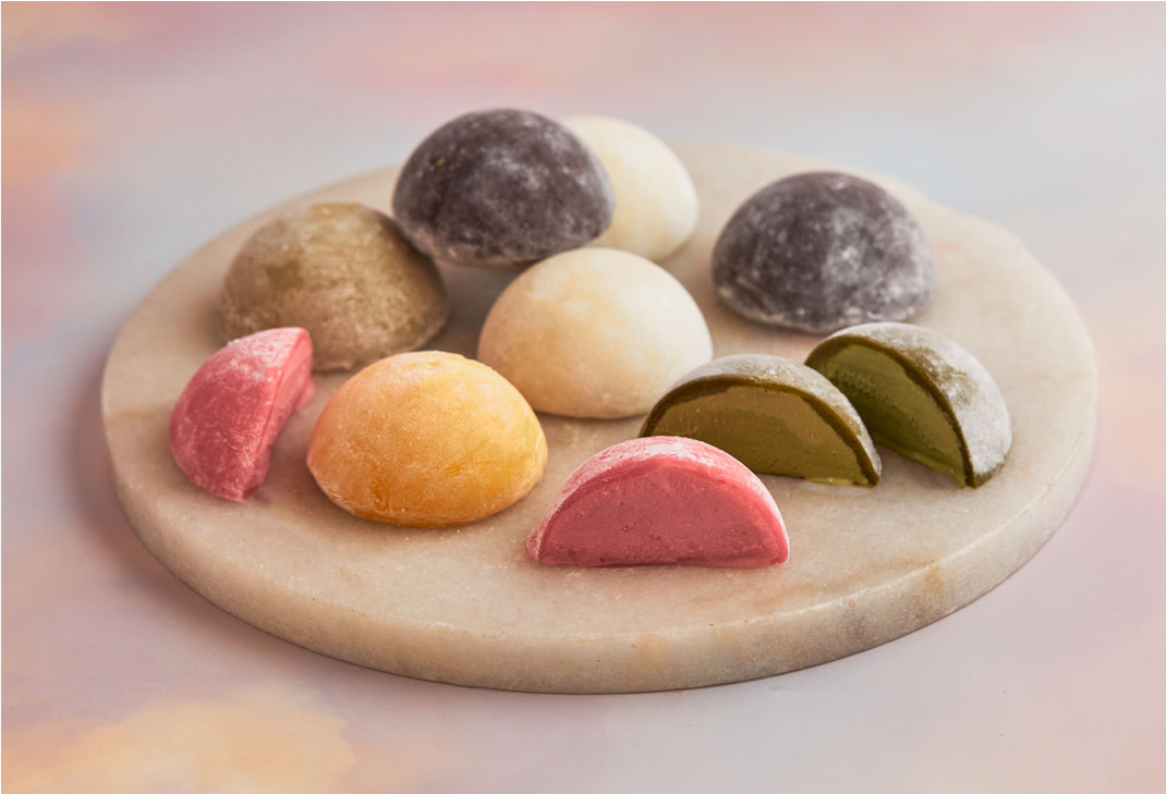 A white plate topped with diverse range of assorted Mochi ice cream of MOISHI best mochi ice cream brand in UAE