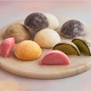 A white plate topped with diverse range of assorted Mochi ice cream of MOISHI best mochi ice cream brand in UAE