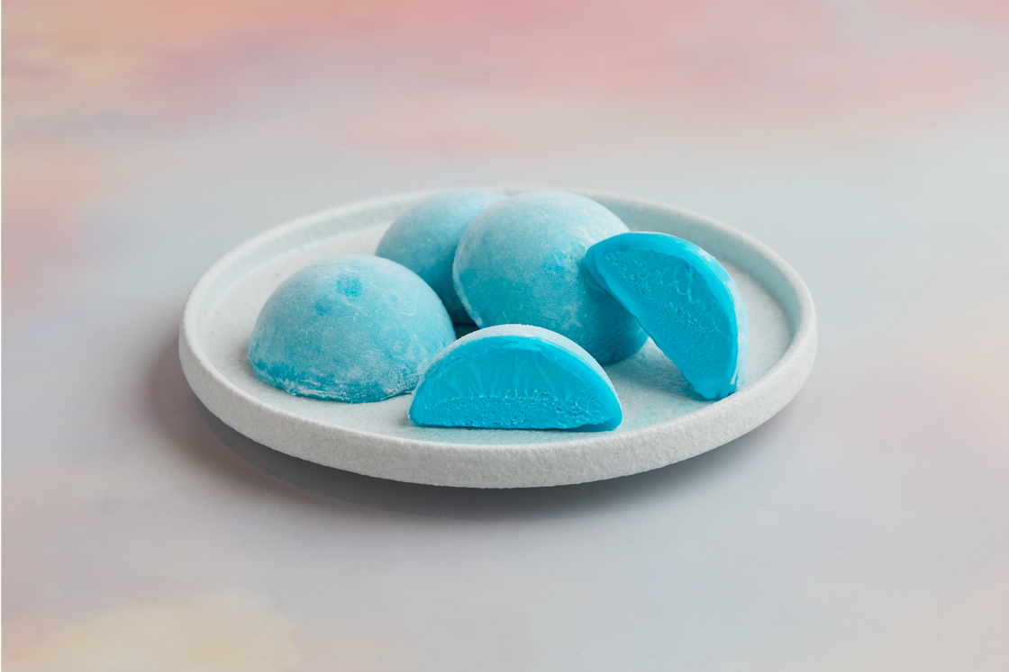 A white plate topped with 4 pieces of Bubble Gum flavored Moishi Ice Cream of MOISHI, the Luxurious Japanese dessert brand in Dubai