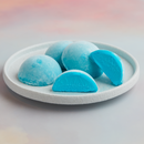 A white plate topped with 4 pieces of Bubble Gum flavored Moishi Ice Cream of MOISHI, the Luxurious Japanese dessert brand in Dubai