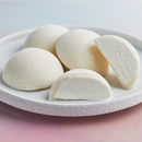 A white plate filled with coconut flavored mochi ice cream from MOISHI Dubai's best mochi ice cream brand.