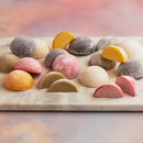 A white plate topped with diverse range of assorted Moishi ice cream of MOISHI a renowned Japanese dessert brand in Dubai.
