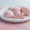 A white plate topped with 4 pieces of Strawberry flavored Moishi Ice Cream of MOISHI, the best mochi ice cream shop in Dubai