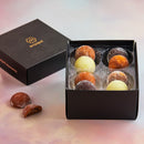 A luxurious box filled with MOISHI mochi truffles on a table - the renowned Japanese confectionery brand in Dubai.