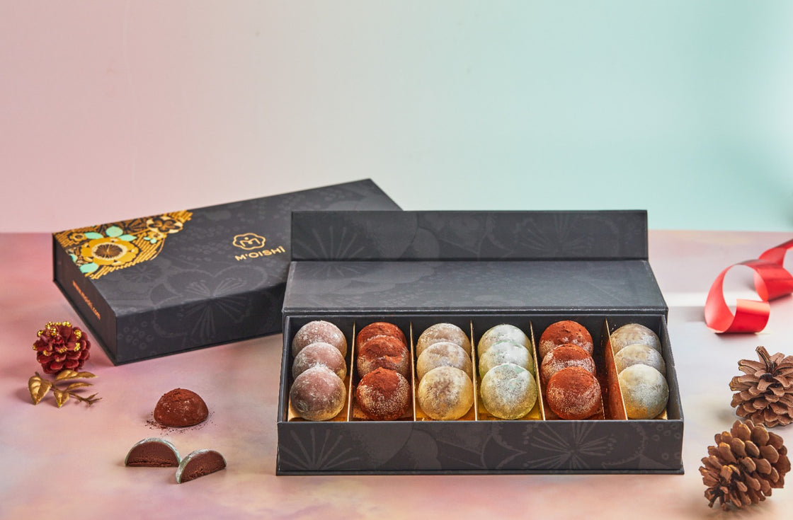 A luxurious box filled with MOISHI mochi truffles on a table - the renowned Japanese confectionery brand in Dubai.